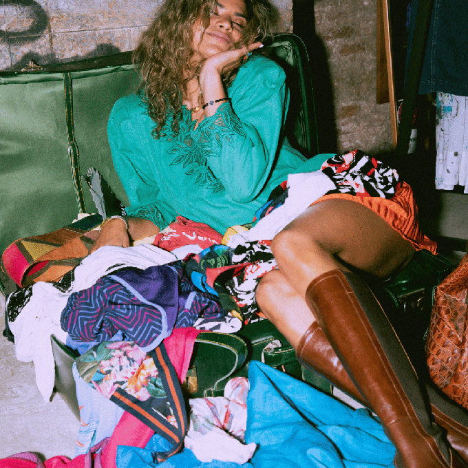 Consumer surrounded by clothes