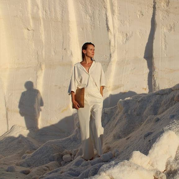 Model holding a bag made with cork as an eco-friendly vegan leather alternative