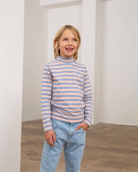 Smiling child wearing ethical kids clothing